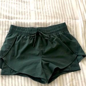 Dark green running shorts. Size medium.